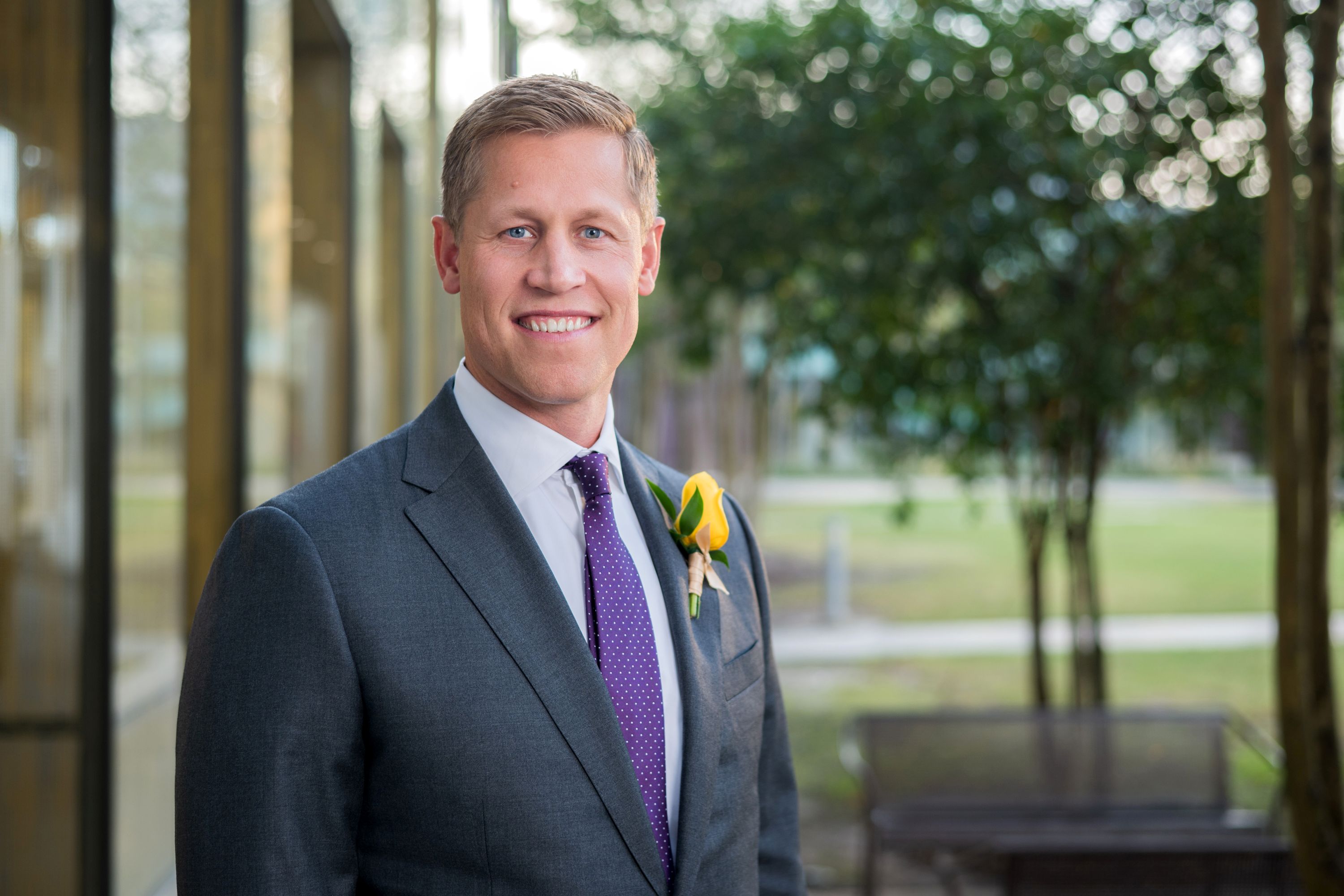 Laust Helmig in a grey suit in the BEC Courtyard 