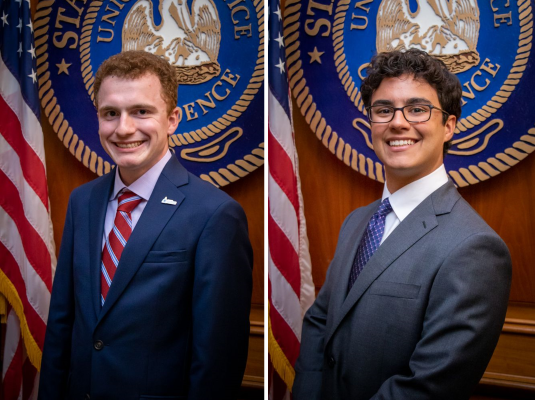 Head shots of two men in suits. Both are in front a the Louisiana State seal with the American flag in the background.