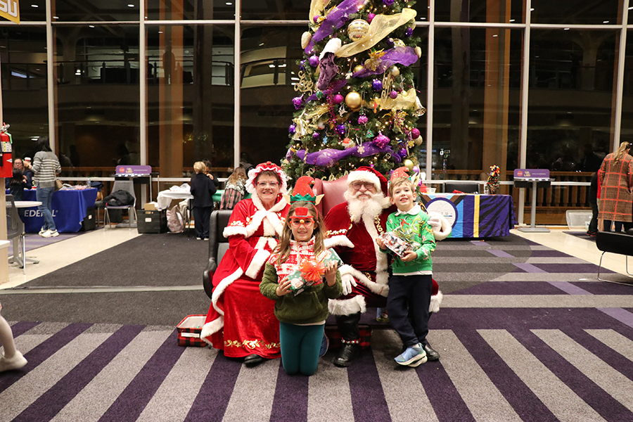 children with Santa and Mrs. Claus